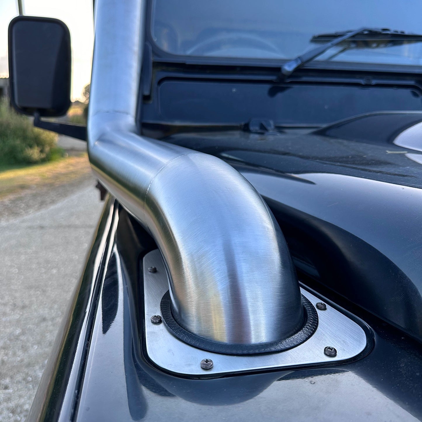 close up of Landrover Defender with stainless steel Snorkle Kit installed top entry