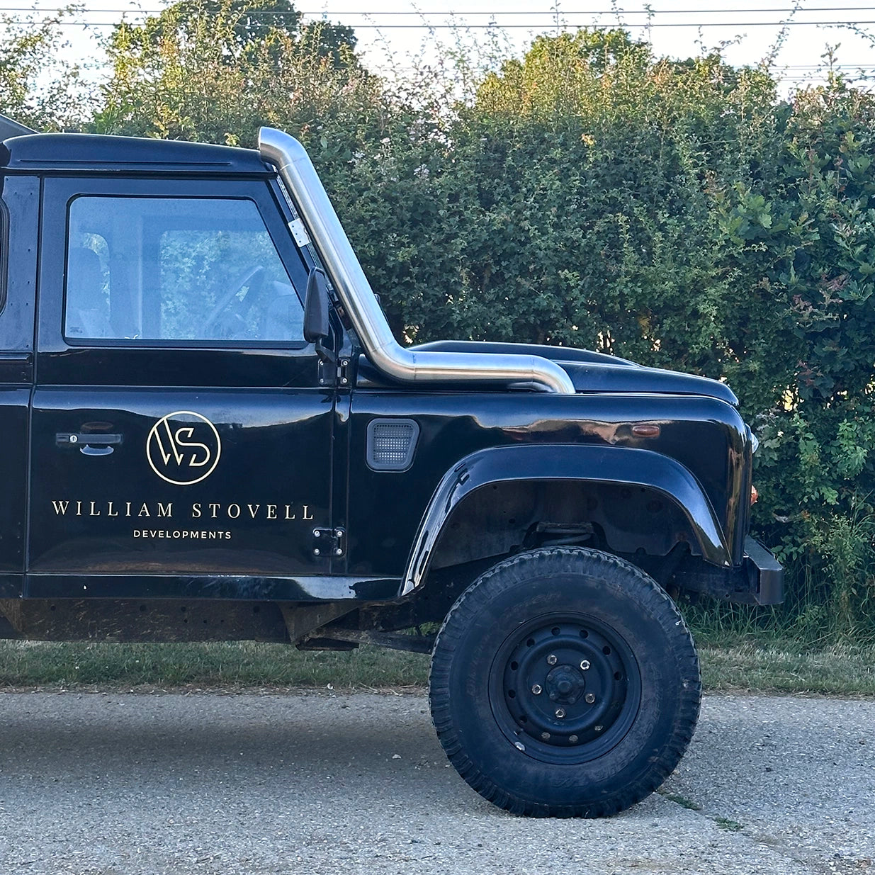 side view of Landrover Defender with stainless steel Snorkle Kit installed