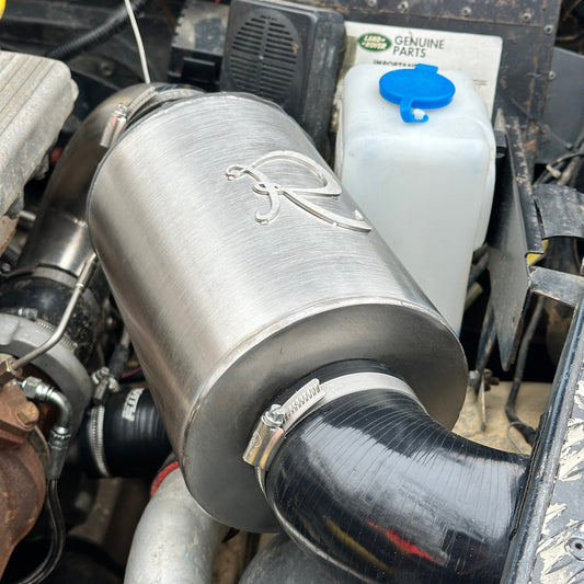 Stainless steel airbox installed in 4x4 engine bay, showcasing upgraded airflow system