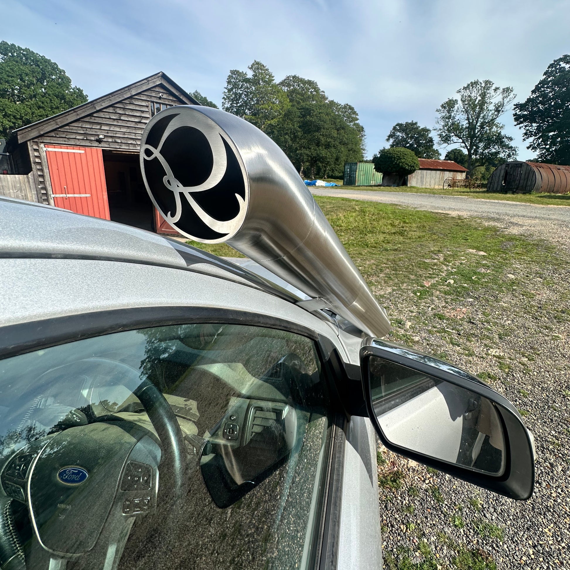 Car side showing 4x4 snorkle with RoyalFab Logo logo in a rural setting
