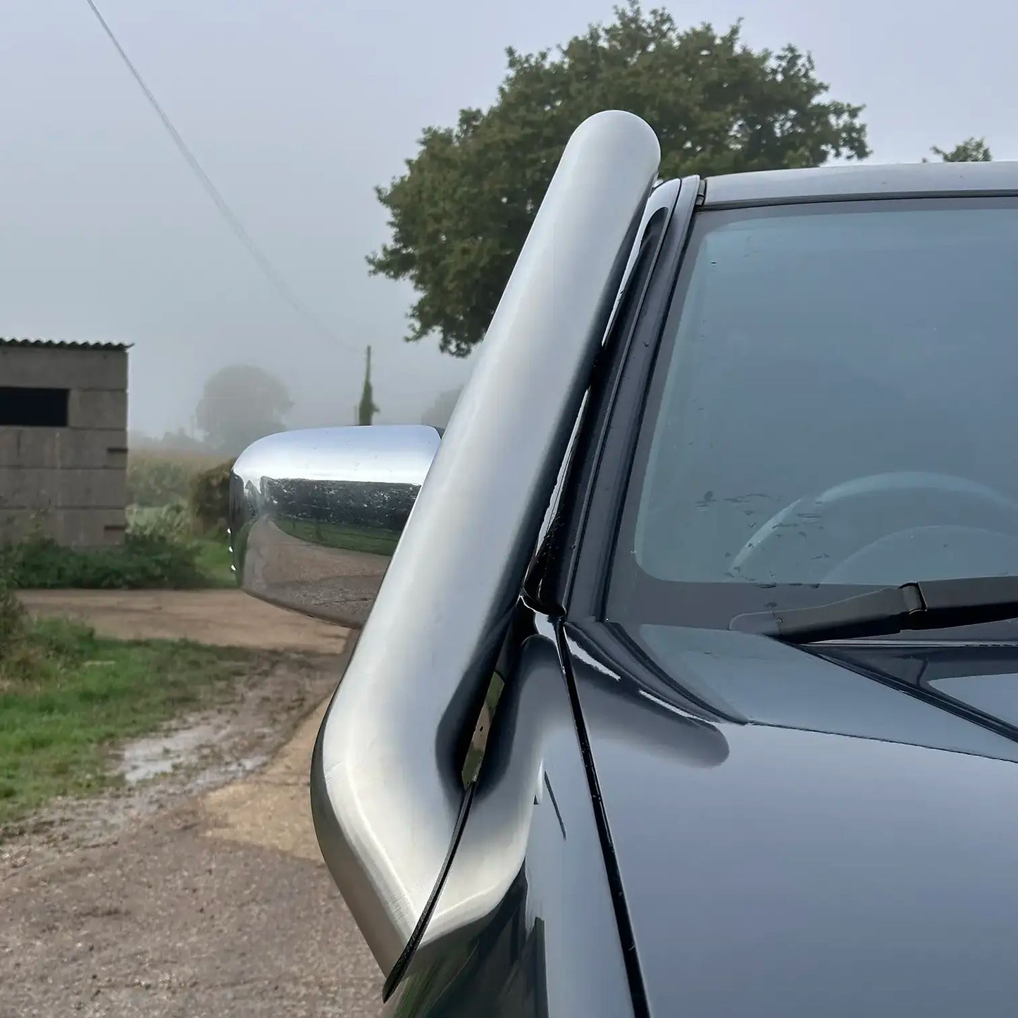 Close-up of short entry snorkel on Mitsubishi L200 with polished 304 stainless steel finish