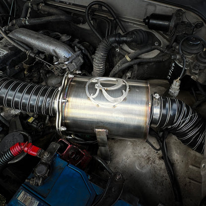 Close-up of a car engine with a Stainless steel airbox filter housing for off road vehicles