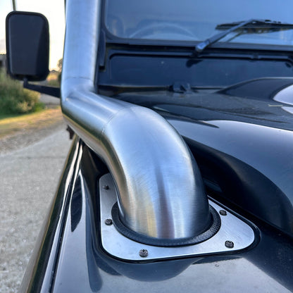 close up of Landrover Defender with stainless steel Snorkle Kit installed top entry