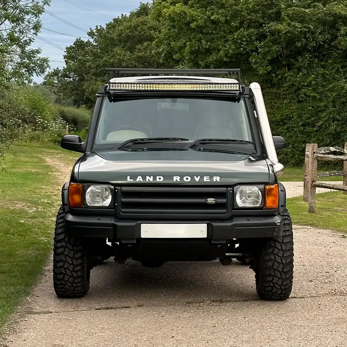 Front angle of the Land Rover Discovery 2 featuring the installed stainless steel snorkel