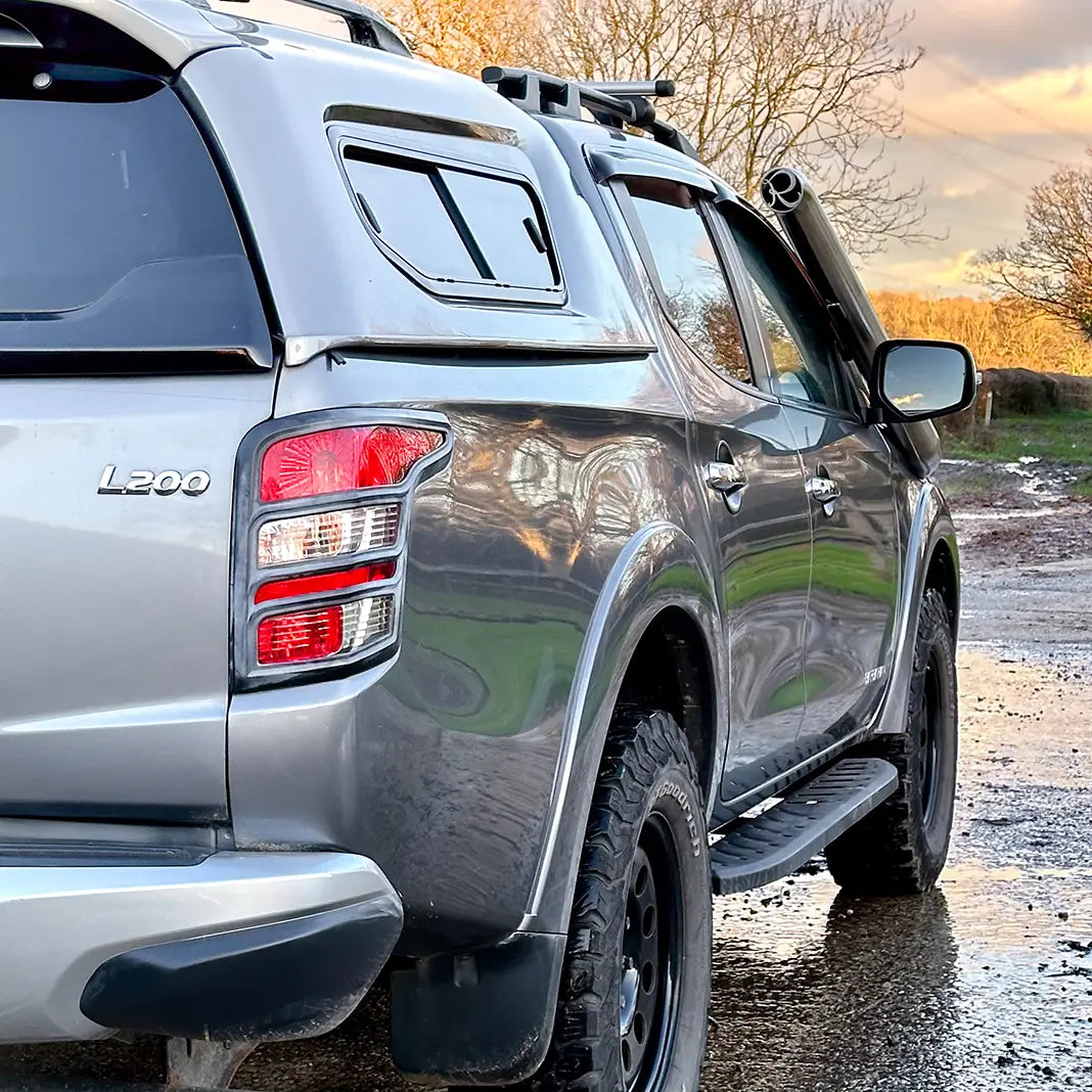Rear angle of Mitsubishi L200 2015–2019 with long entry snorkel kit installed